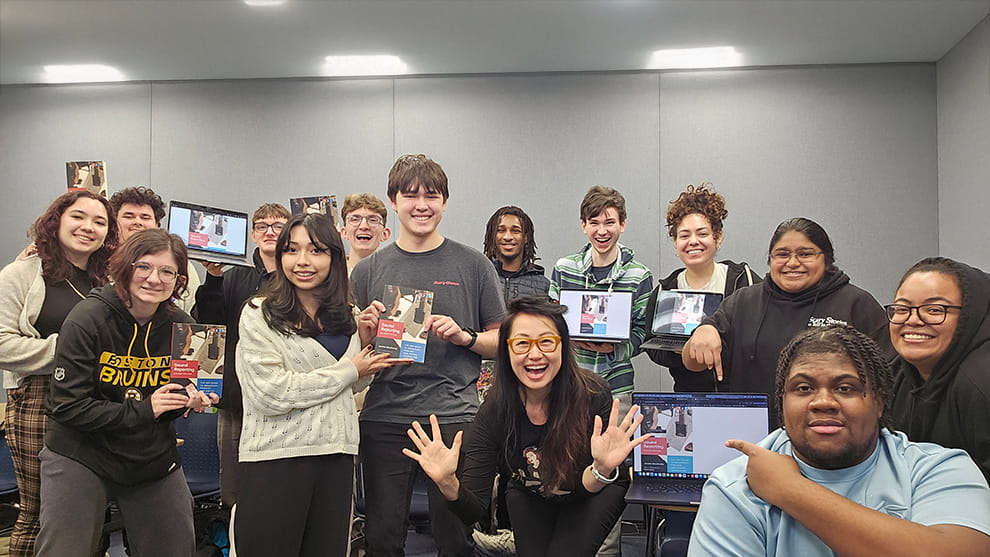 Doualy Xaykaothao (kneeling, center), WRHU professional in residence, with her students.